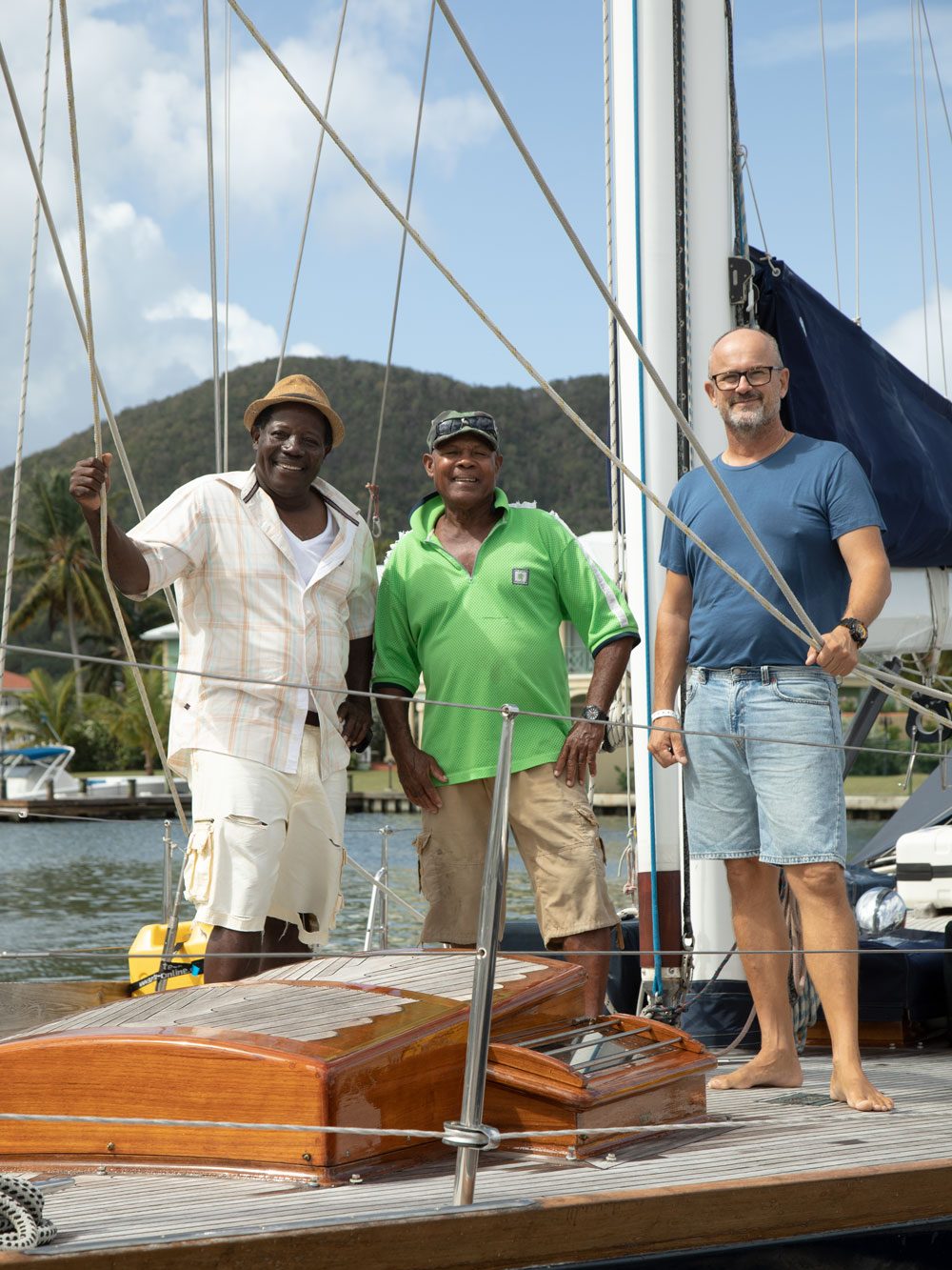 The Varnish Doctors on board a classic yacht that they have just finished varnishing in Rodney Bay Marina, St Lucia, Caribbean Sea